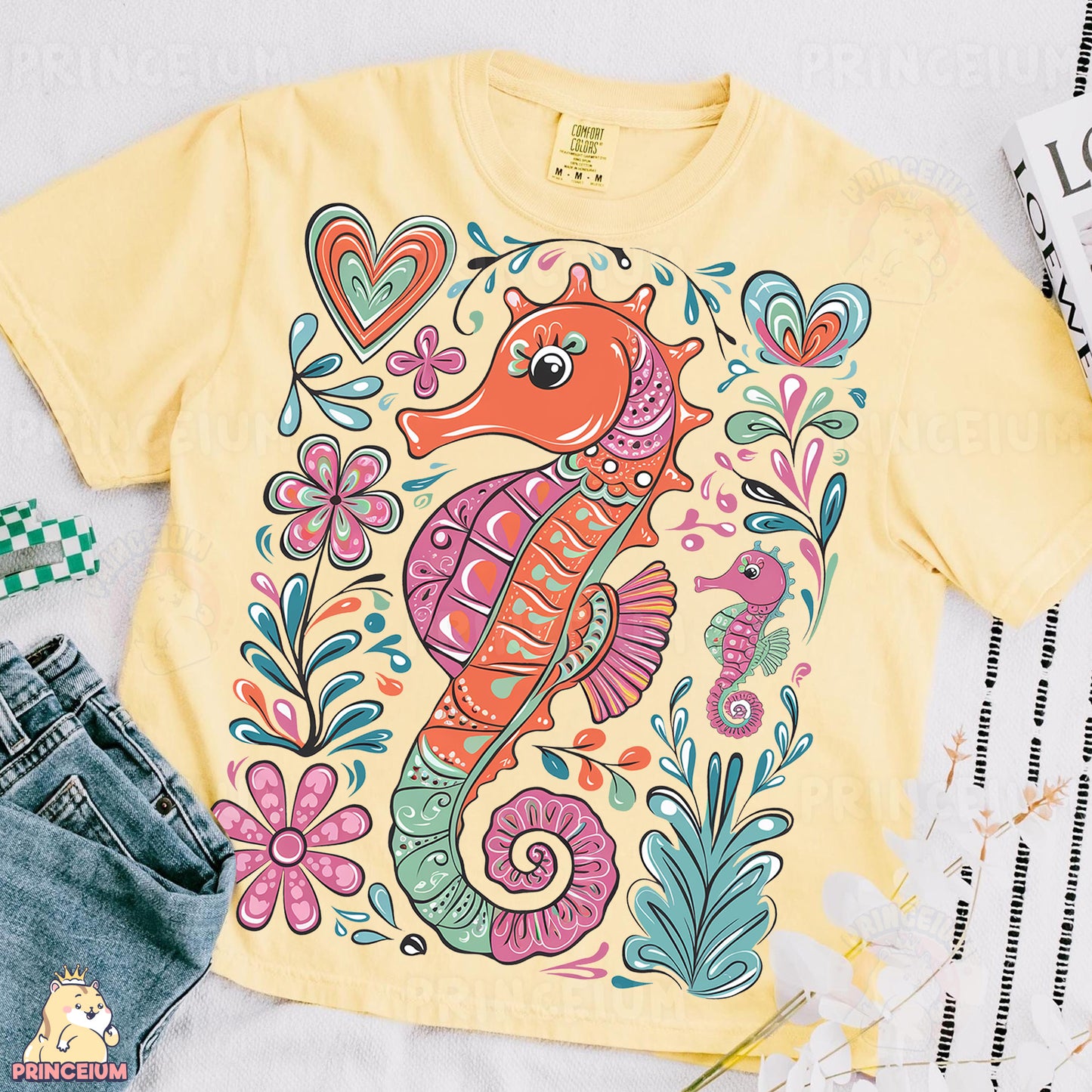 a yellow shirt with a sea horse on it