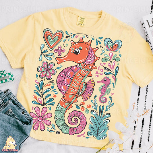a yellow shirt with a sea horse on it
