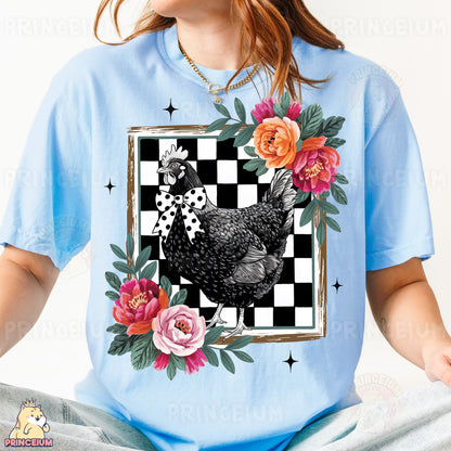 a woman wearing a t - shirt with a chicken on it