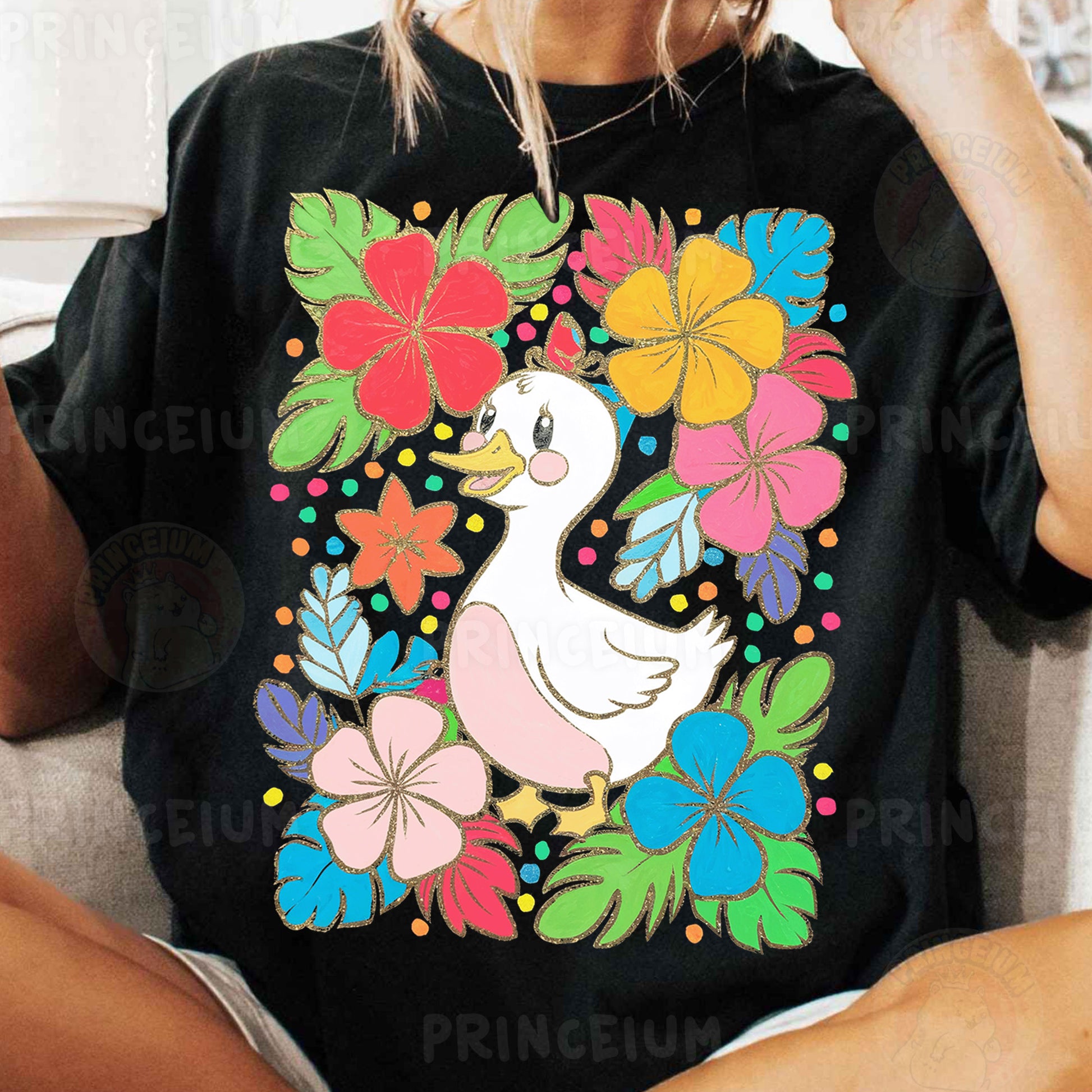 a woman sitting on a couch wearing a t - shirt with a duck on it