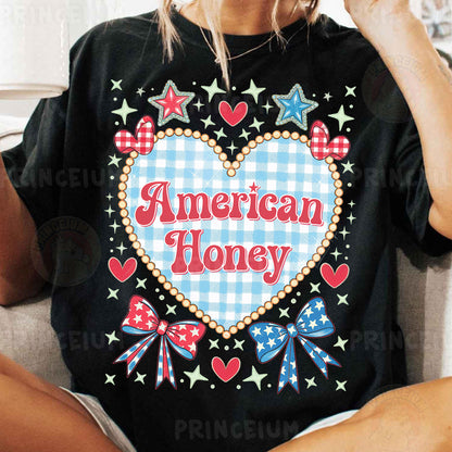 a woman sitting on a couch wearing a black american honey shirt