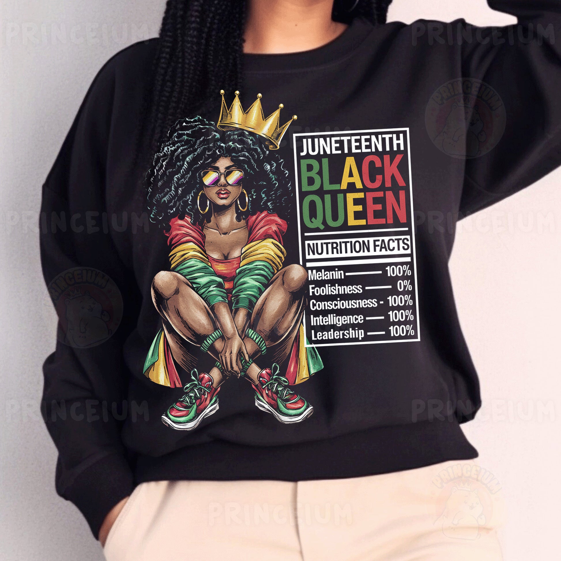 a woman wearing a black sweatshirt with a black queen on it