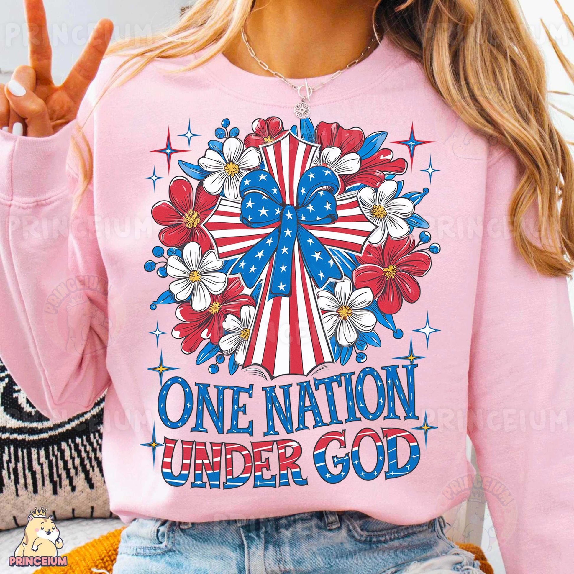 a woman wearing a pink shirt that says one nation under god