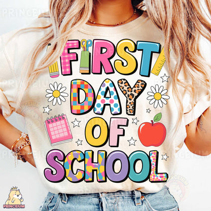 a woman wearing a t - shirt that says first day of school