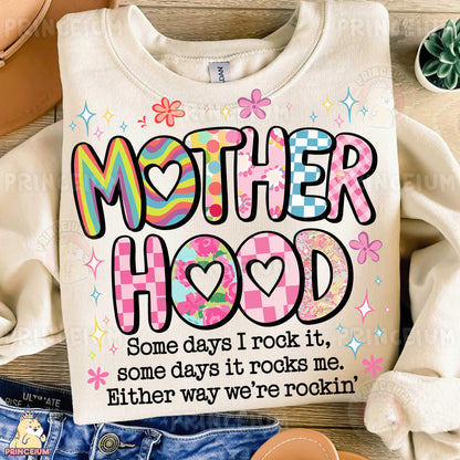 a t - shirt that says, motherhood some days i rock it some days