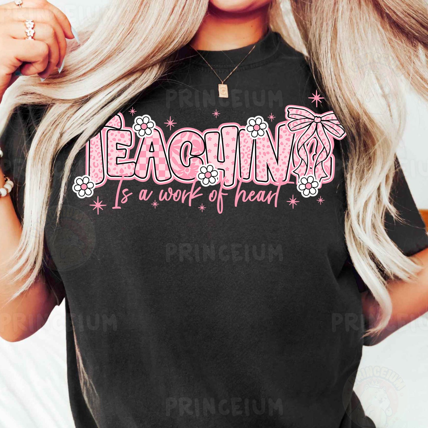 a woman with long blonde hair wearing a black shirt