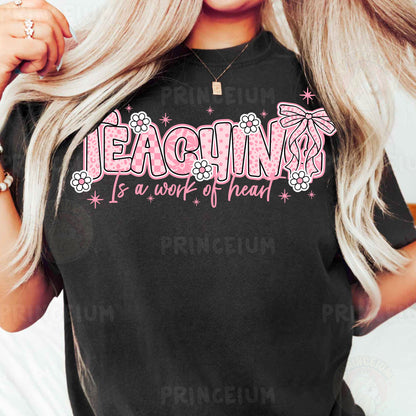 a woman with long blonde hair wearing a black shirt