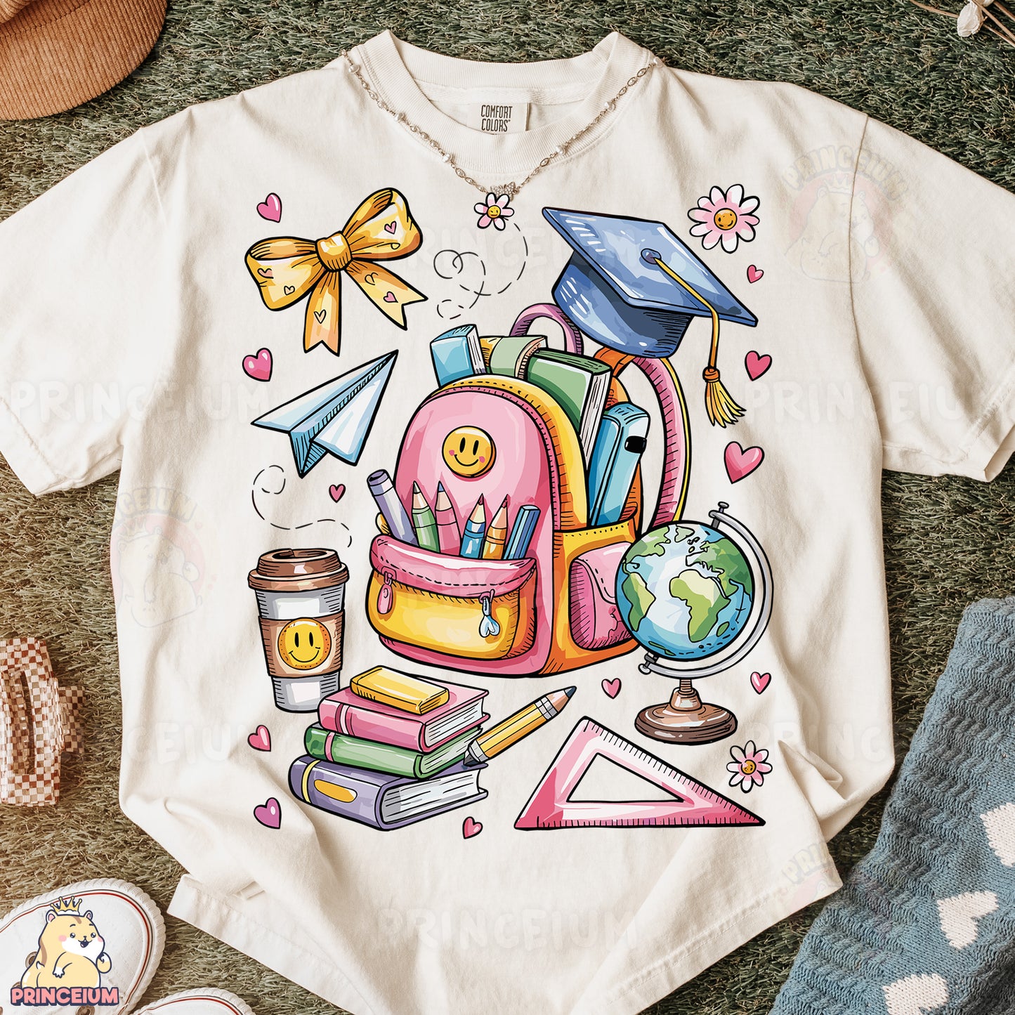 a t - shirt with a picture of a backpack and books