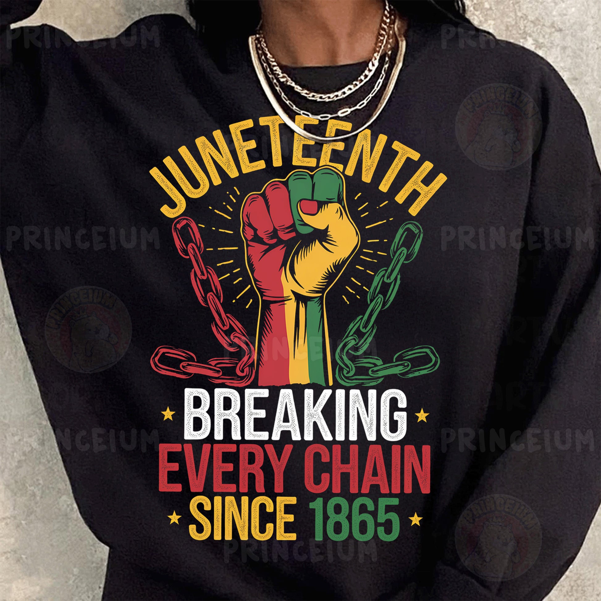 a woman wearing a black sweatshirt with a fist on it