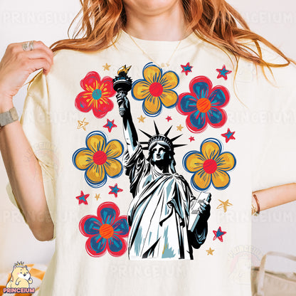 a woman wearing a t - shirt with the statue of liberty on it