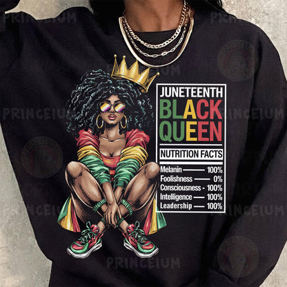 a woman wearing a black sweatshirt with a black queen graphic on it