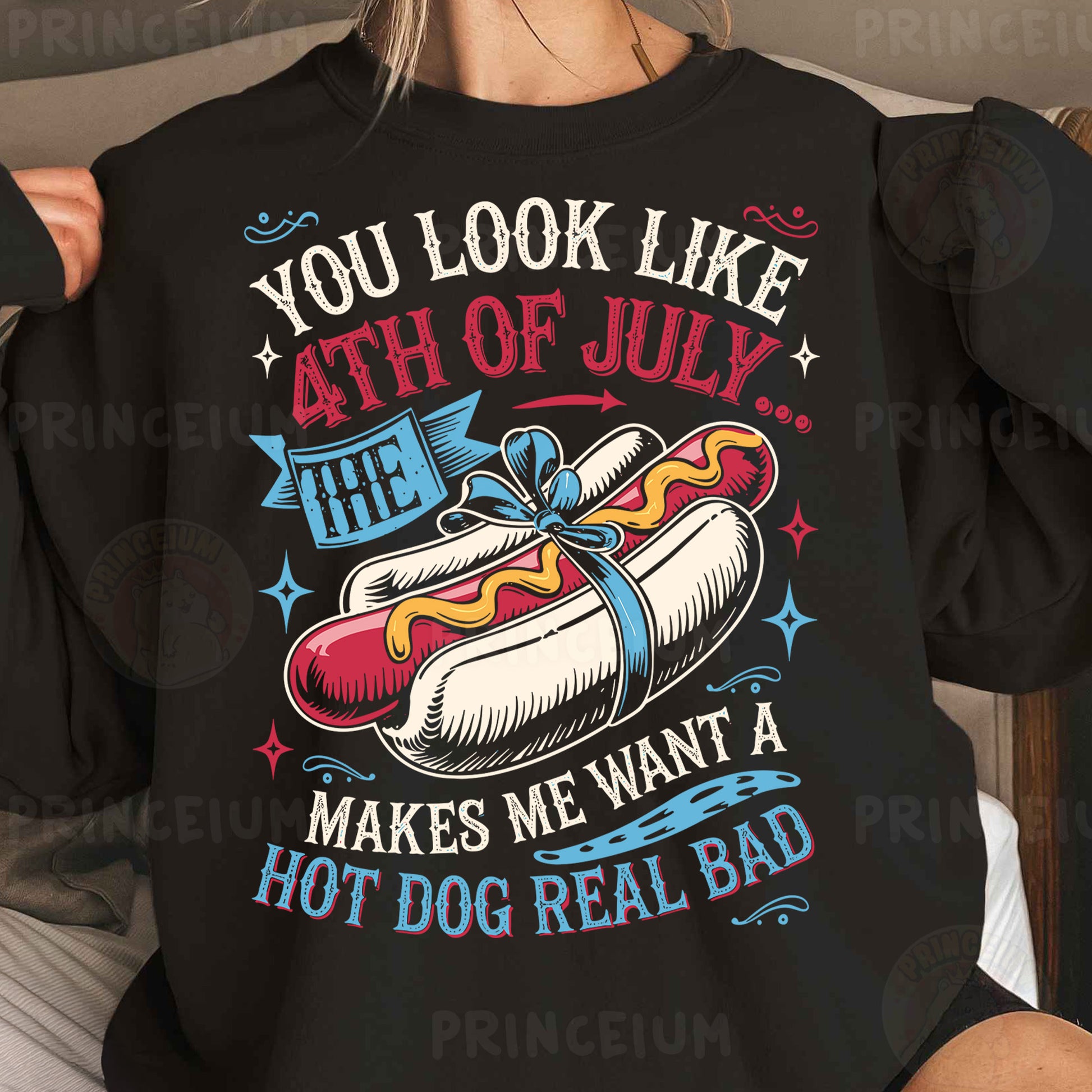 a woman wearing a black shirt with a hot dog on it