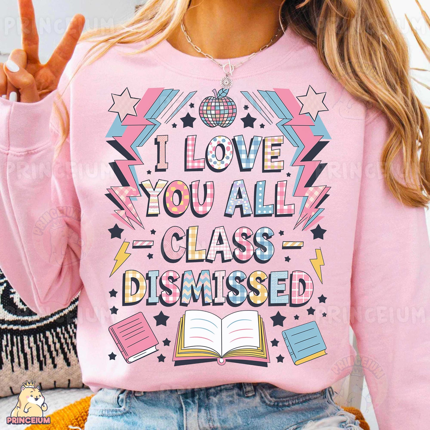 a woman wearing a pink shirt with a book on it