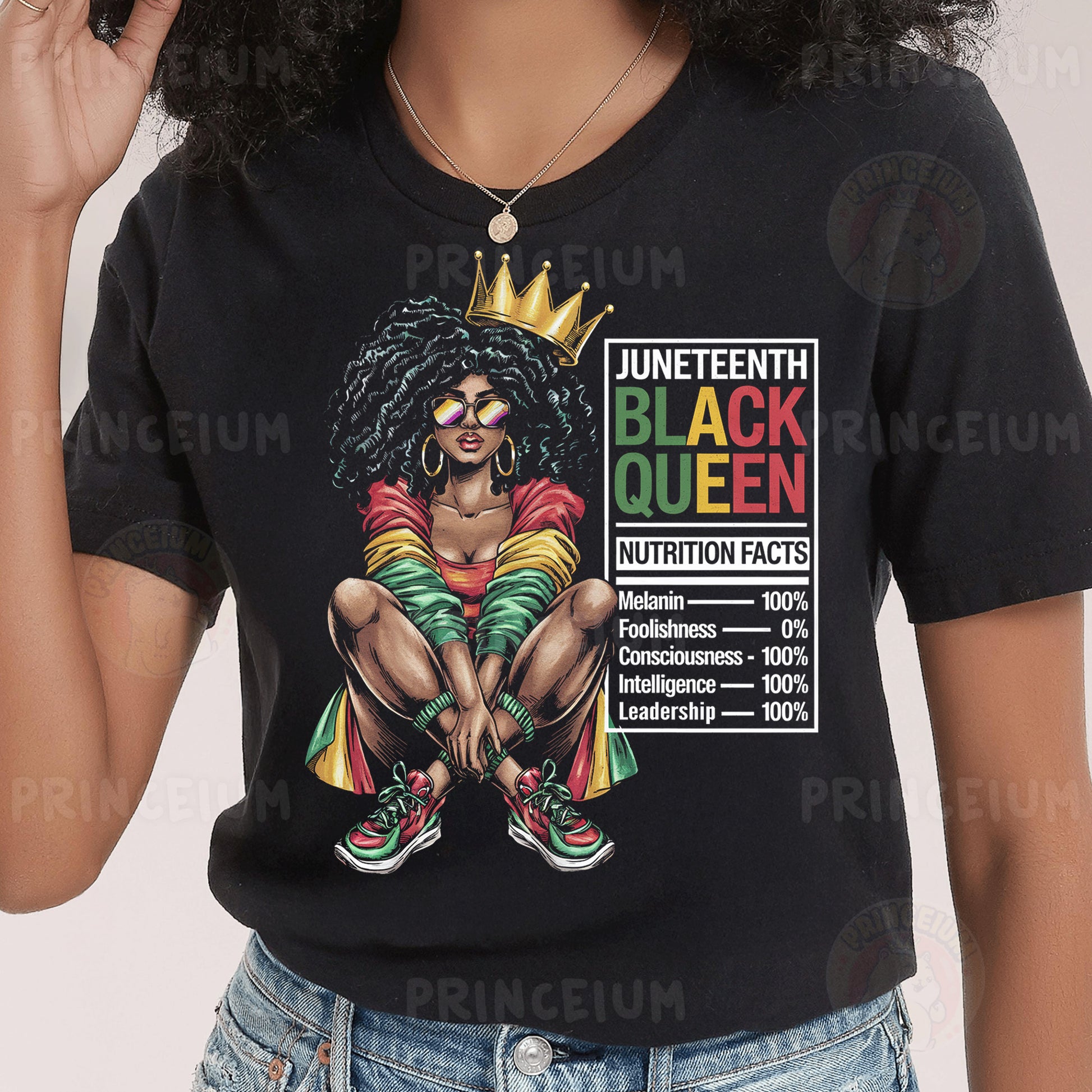 a woman wearing a black t - shirt with a black queen on it