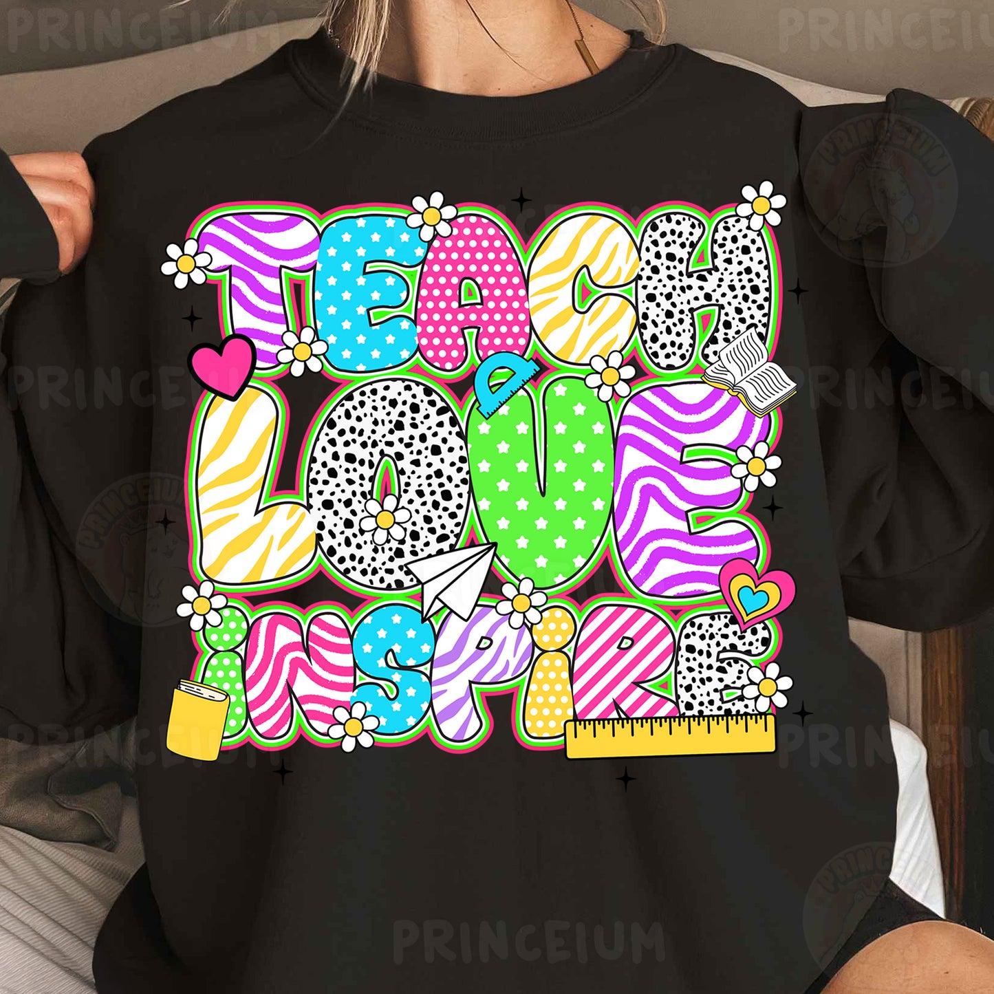 a woman wearing a black shirt with colorful letters on it