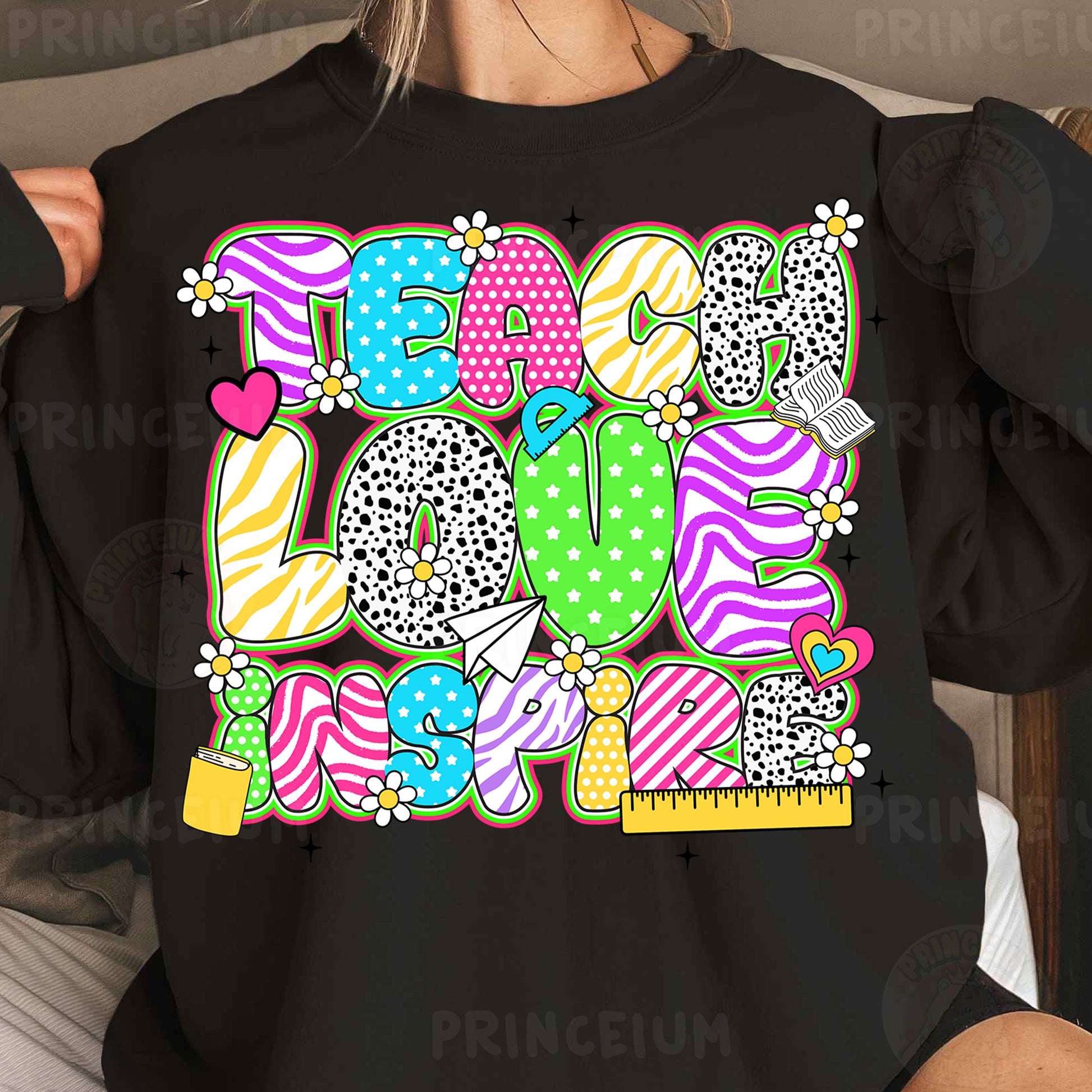 a woman wearing a black shirt with colorful letters on it