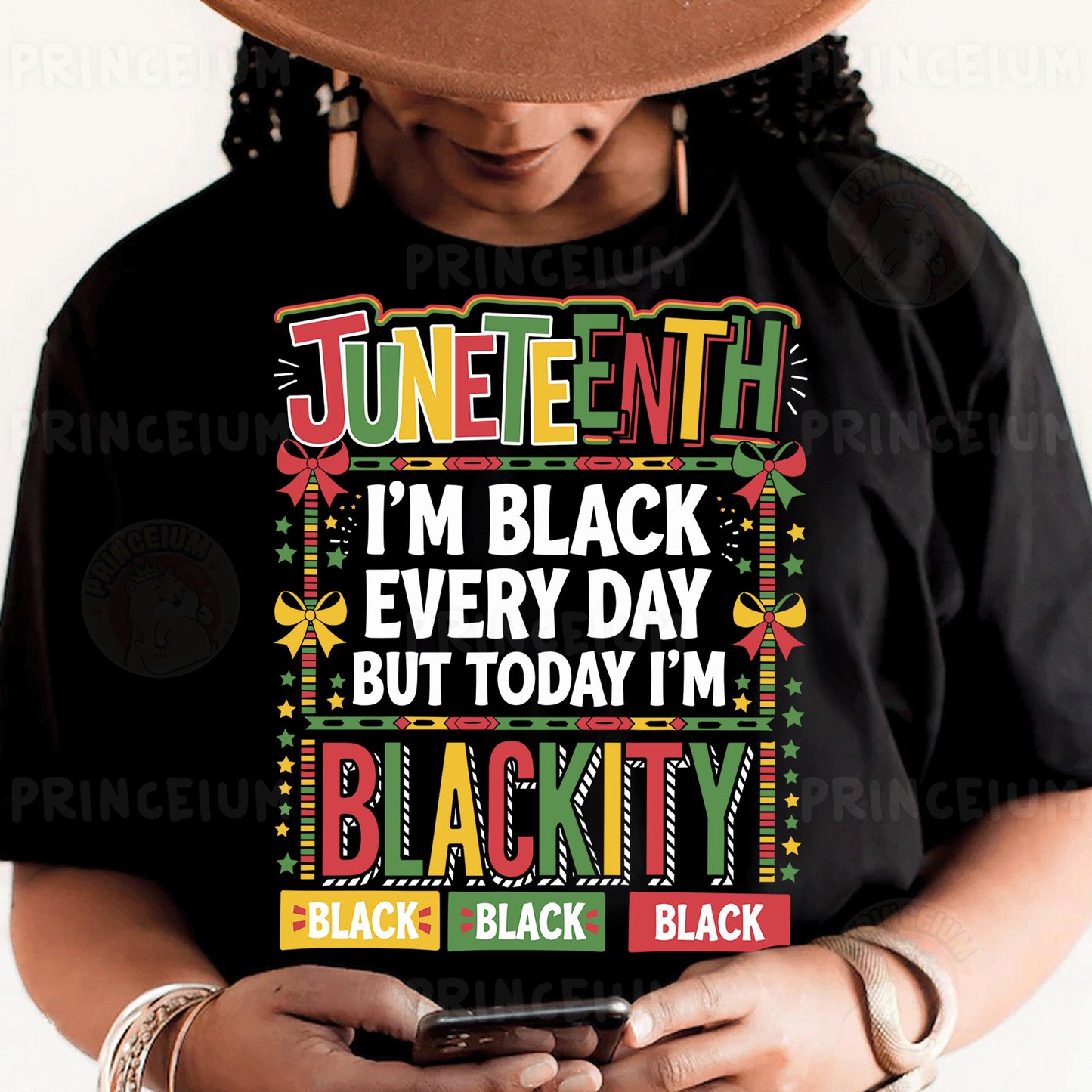 a woman wearing a black t - shirt and holding a smart phone