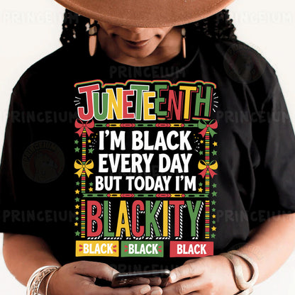 a woman wearing a black t - shirt and holding a smart phone