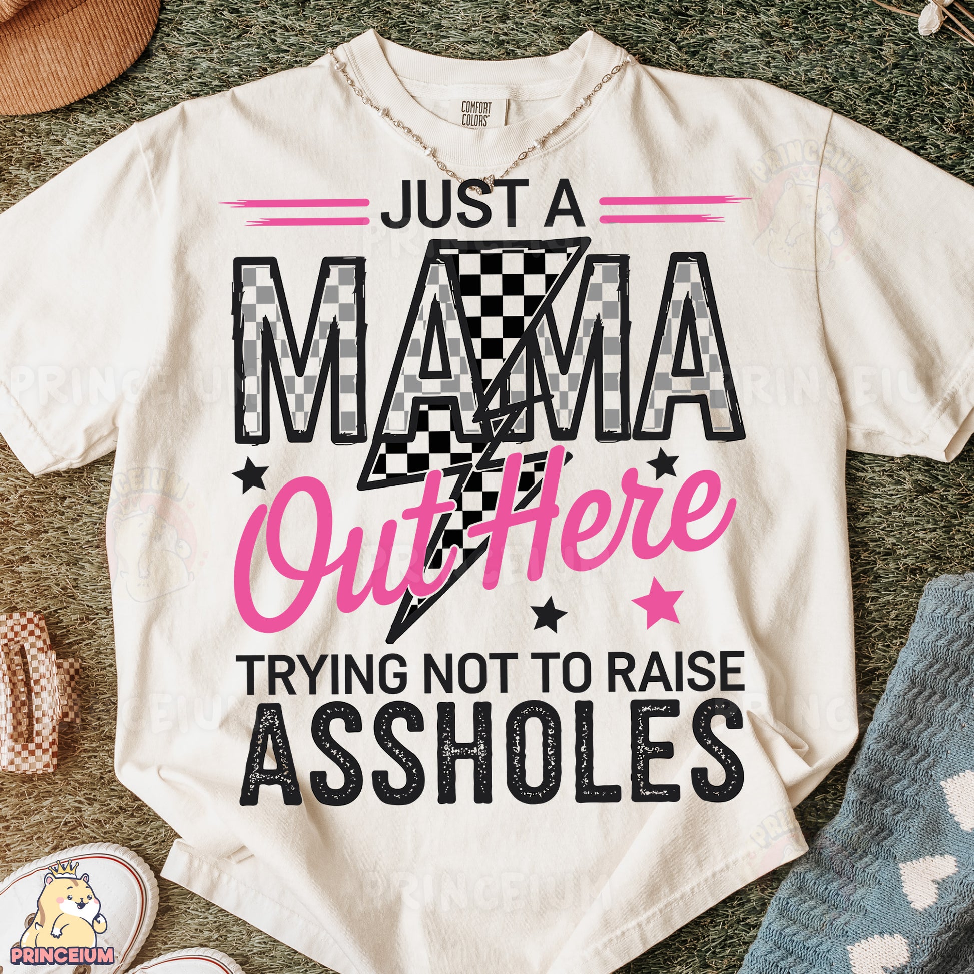a t - shirt that says just a mama out there trying not to raise as