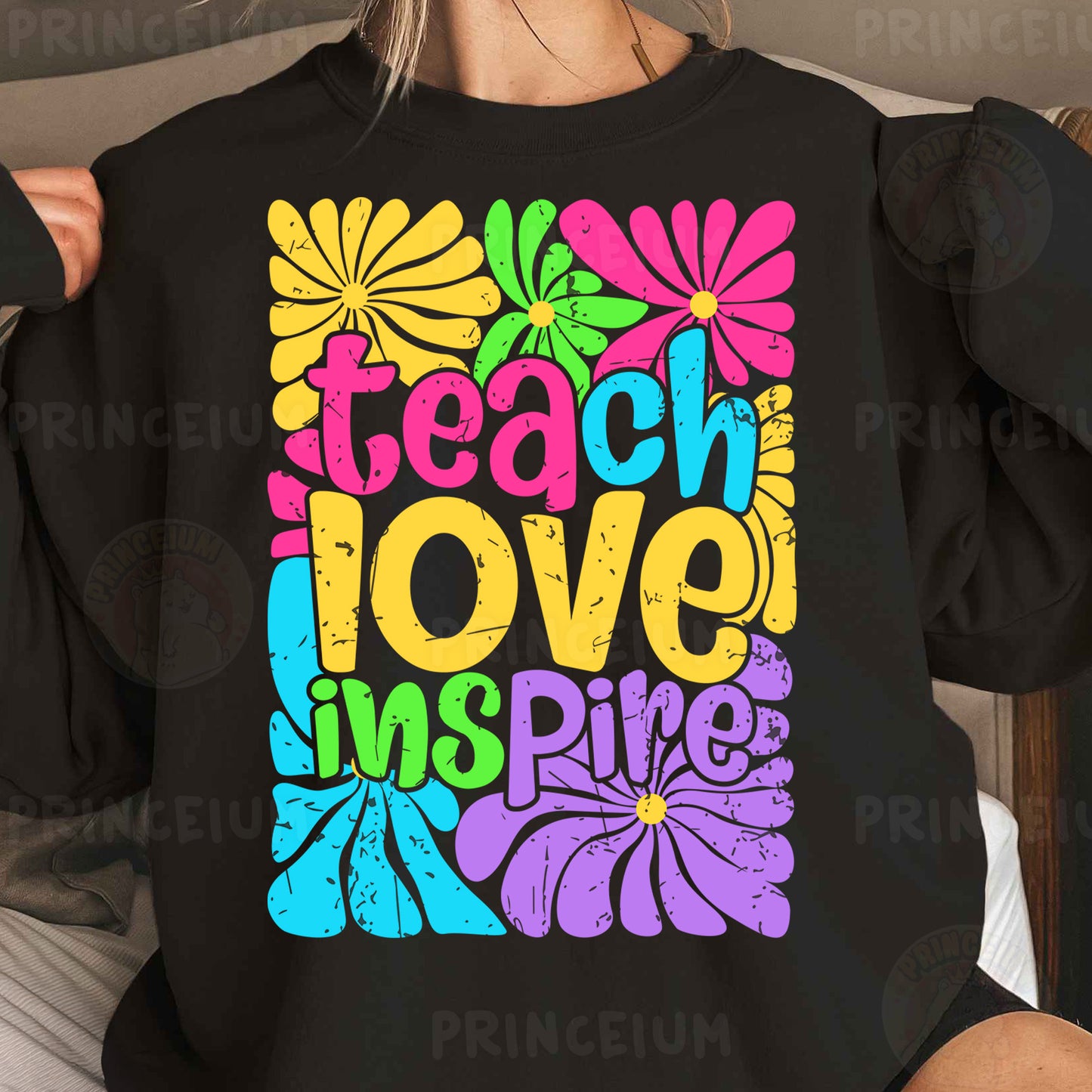 a woman wearing a black teacher love shirt
