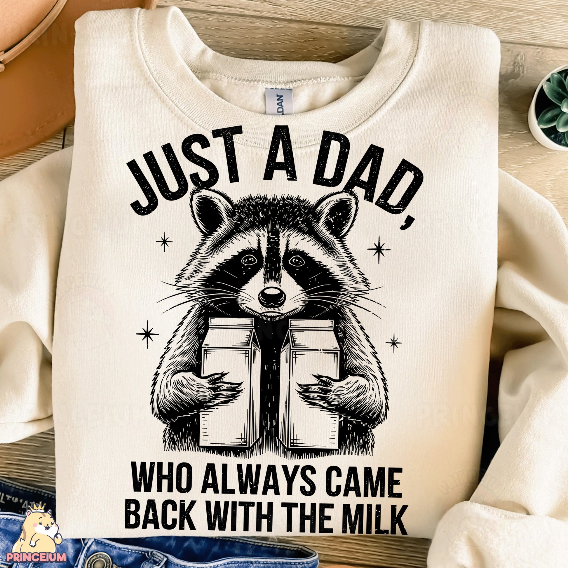 a shirt with a raccoon holding a box that says just a dad who