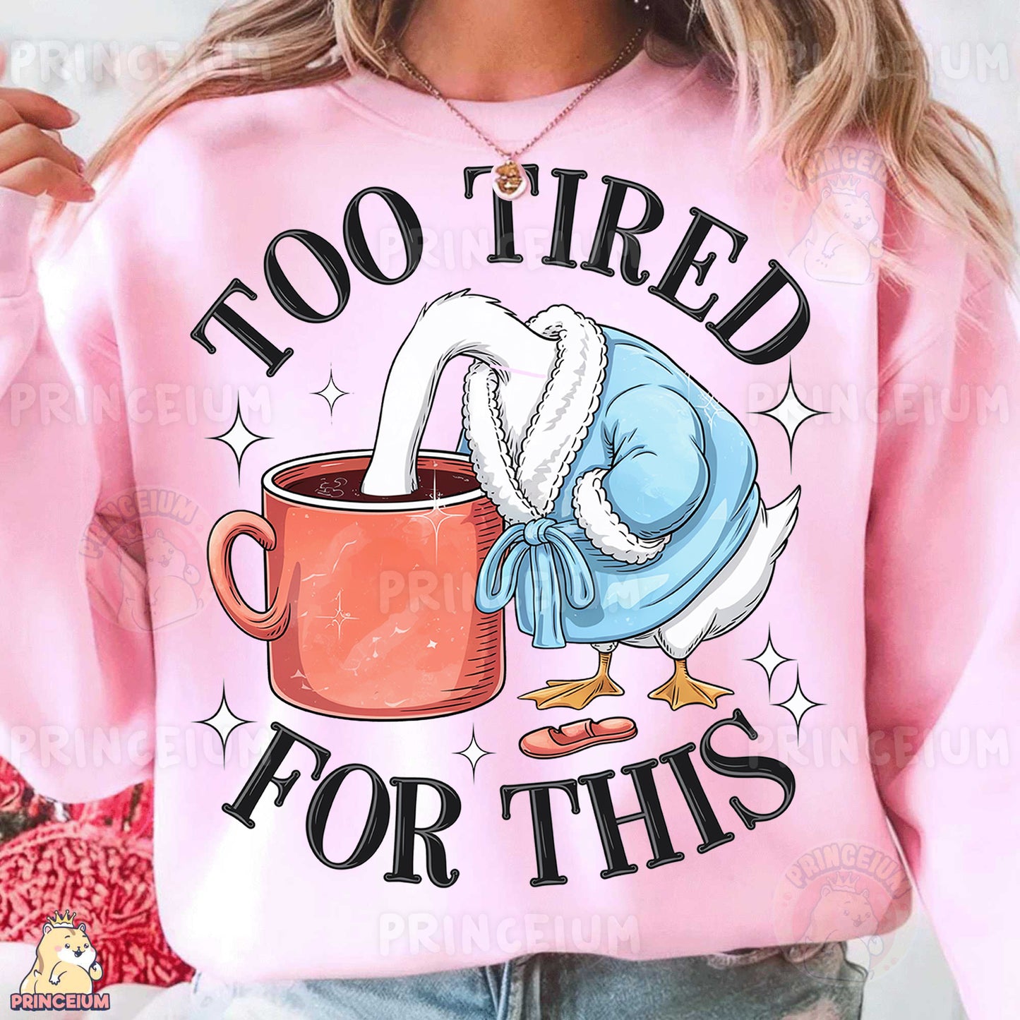 a woman wearing a pink sweatshirt with a coffee mug printed on it