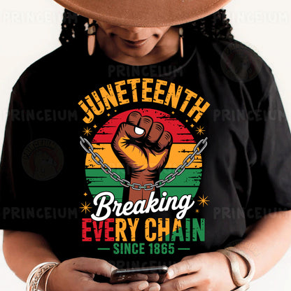 a person wearing a black shirt with a fist on it