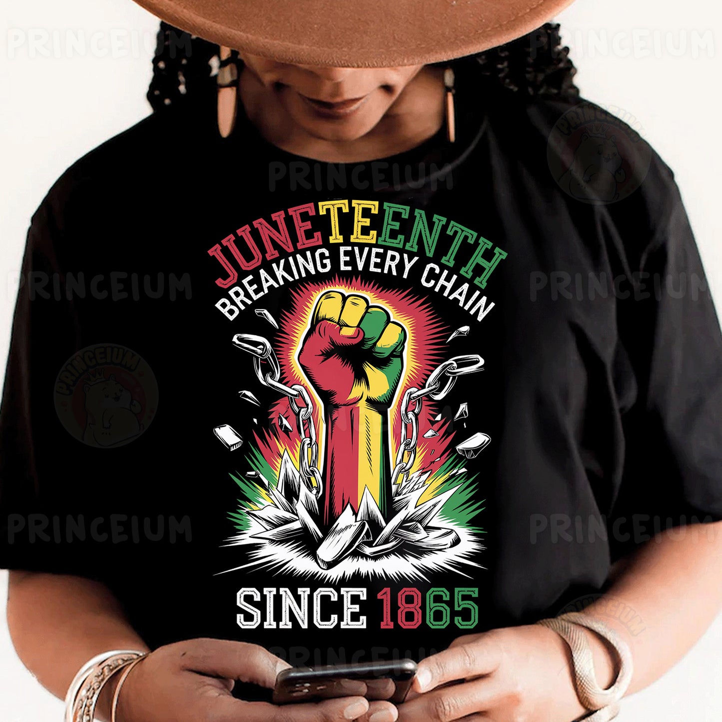 a person wearing a black shirt and a hat holding a cell phone