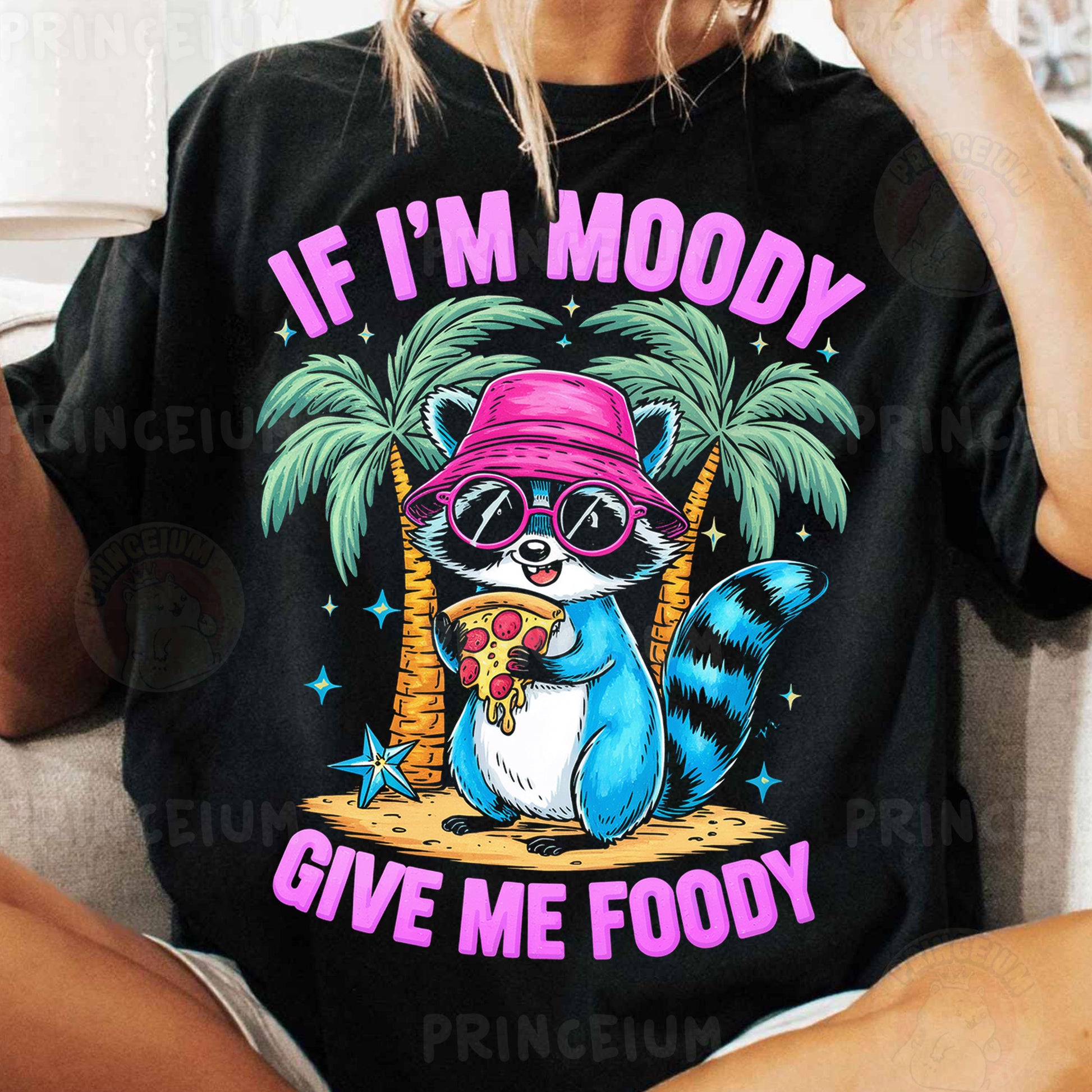 a woman wearing a black shirt with a raccoon wearing a pink hat and