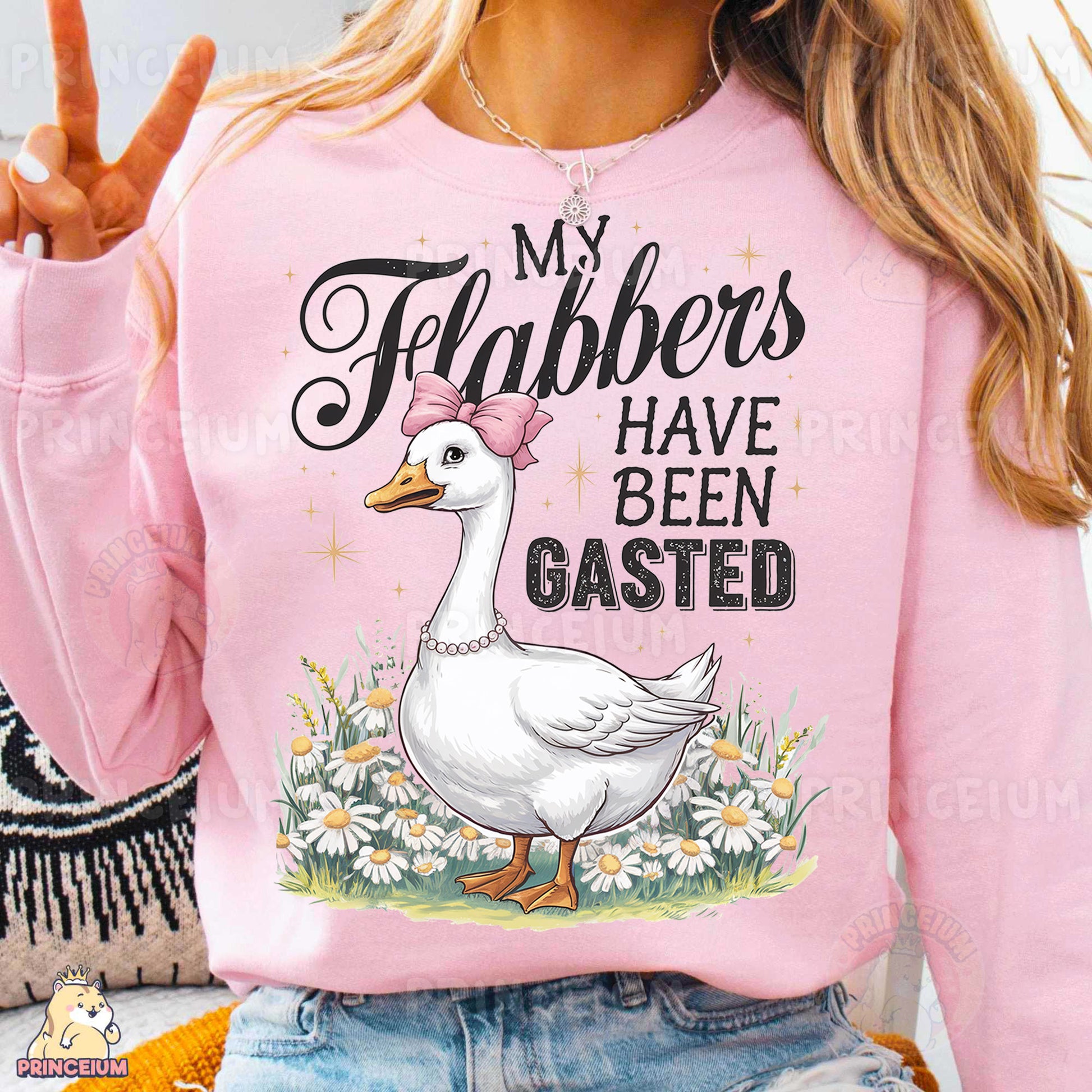 a woman wearing a pink shirt with a white duck on it