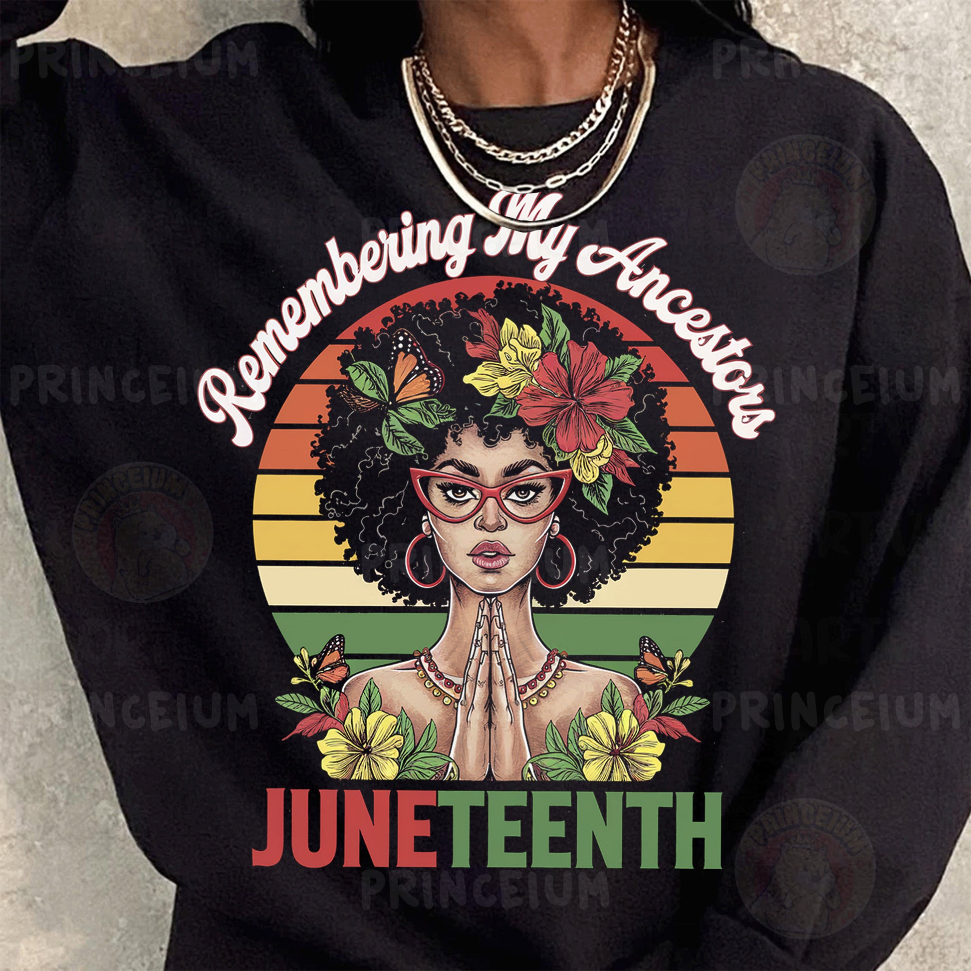 a woman wearing a black shirt that says juneteeth