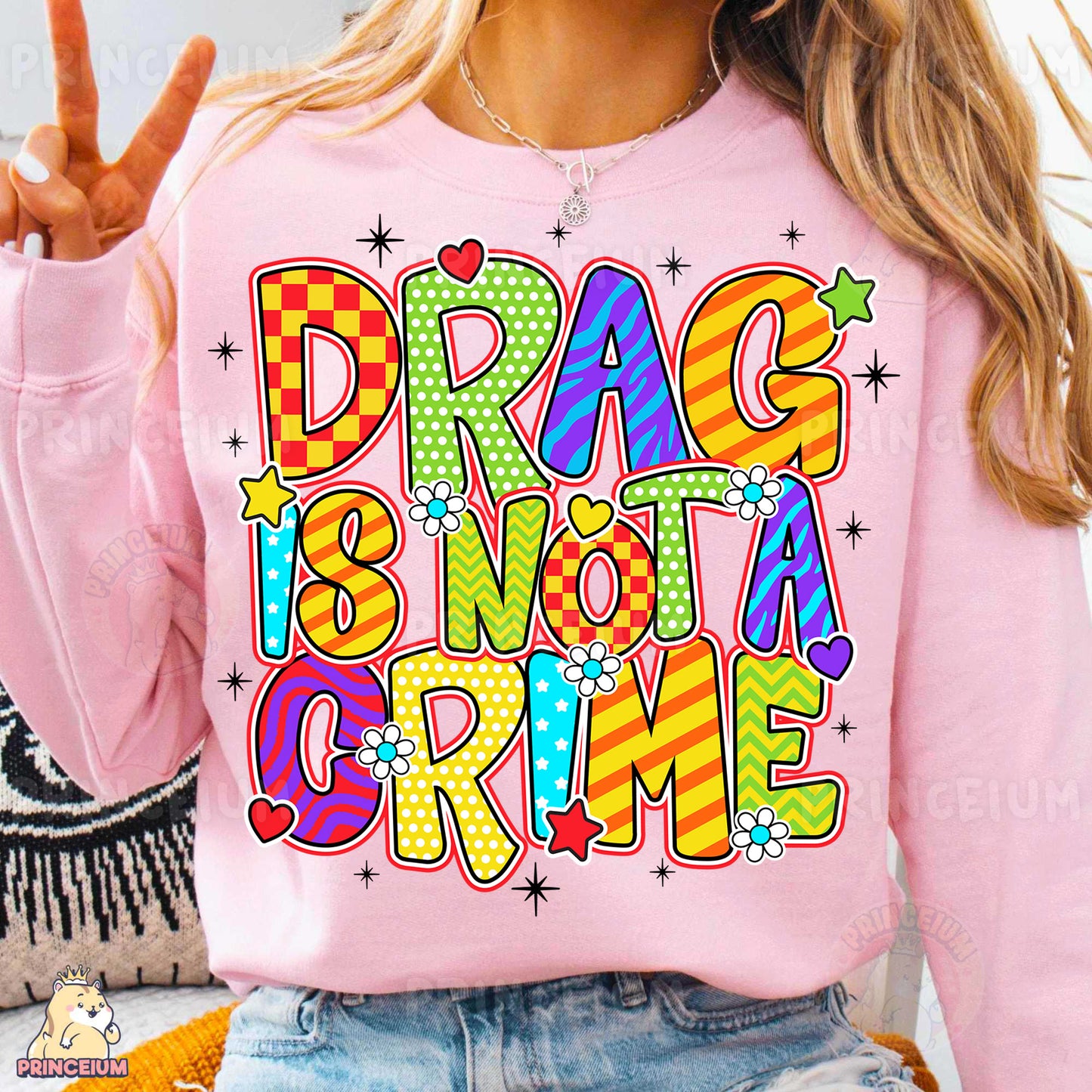a woman wearing a pink shirt that says drag some girls