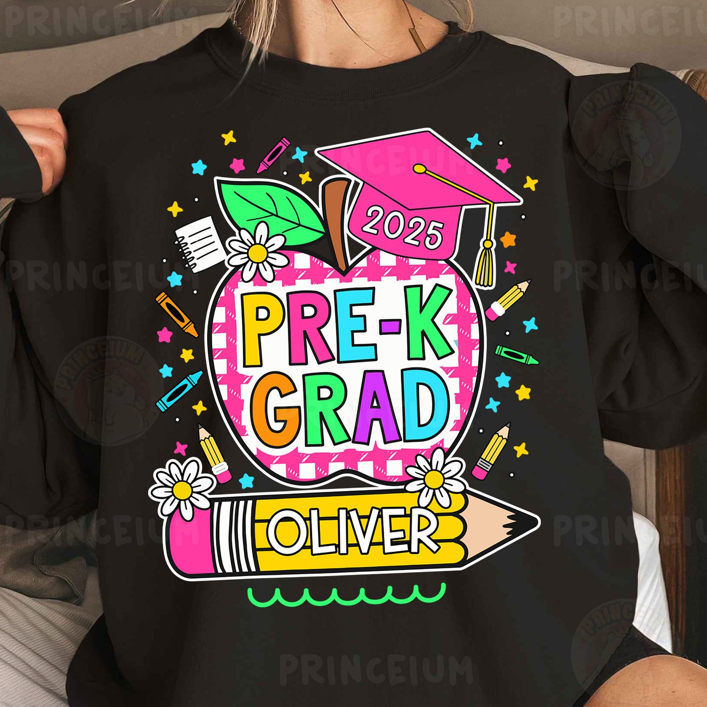 a woman wearing a black shirt with a pink and green graphic on it