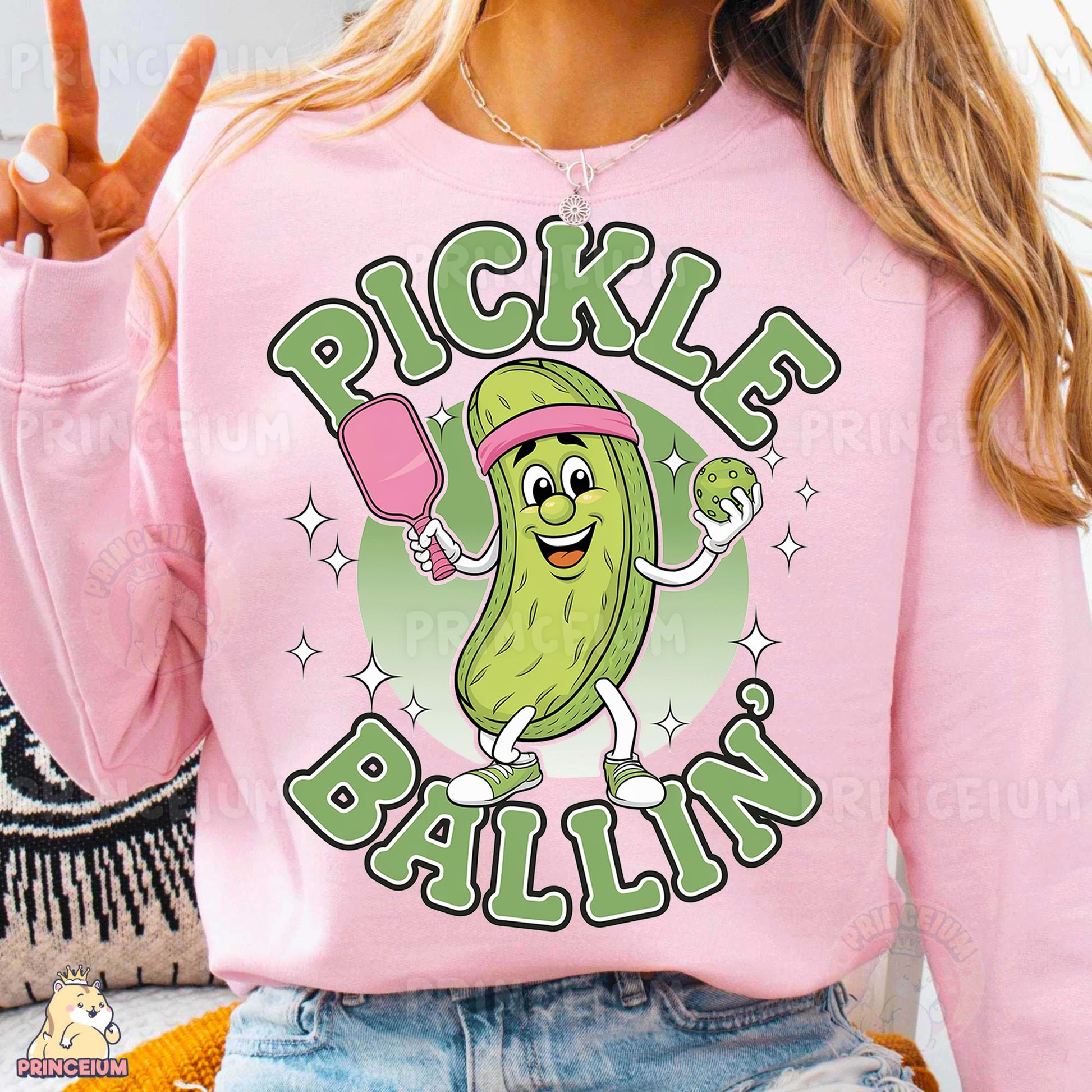 a woman wearing a pink pickle ballin shirt