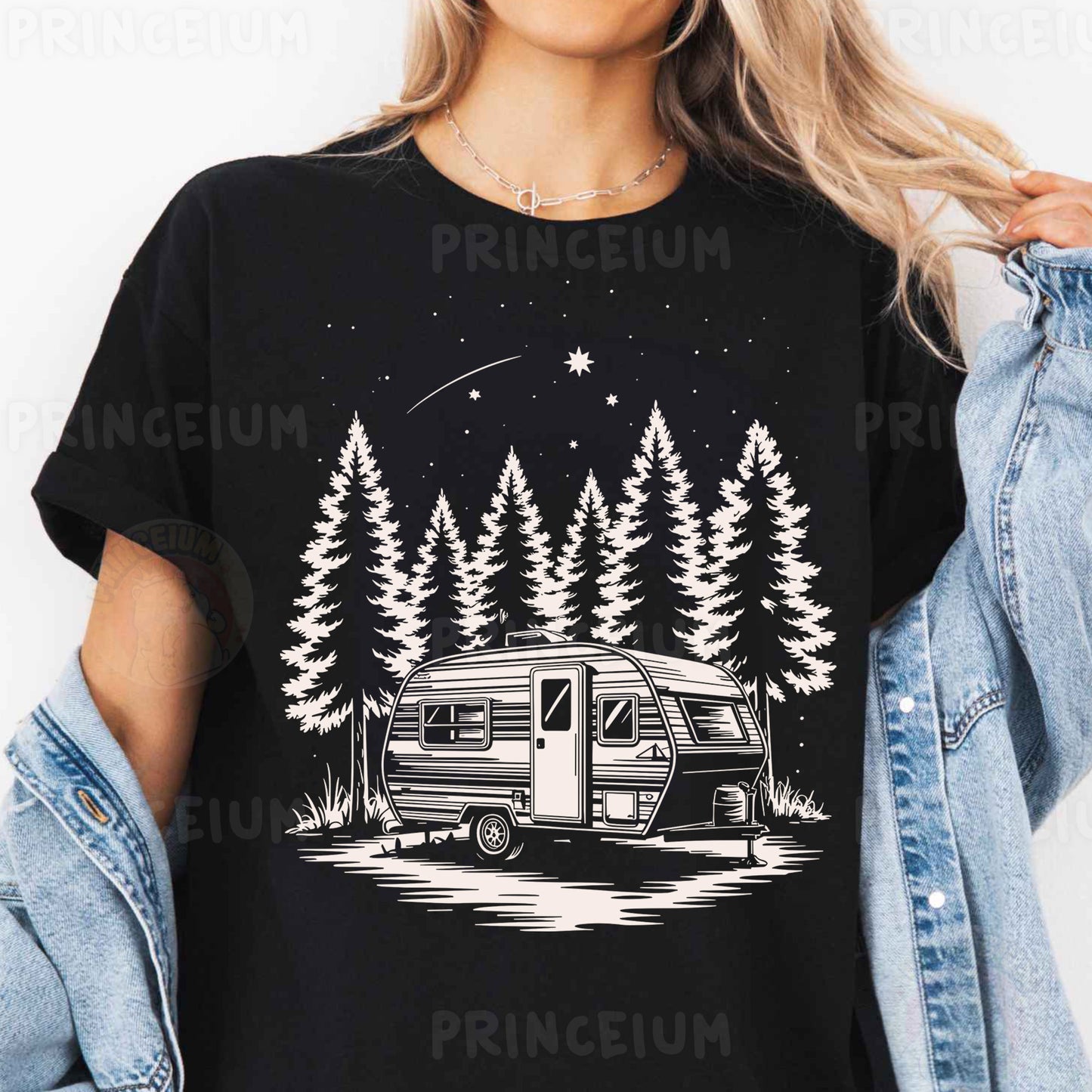 a woman wearing a black shirt with a camper and trees on it