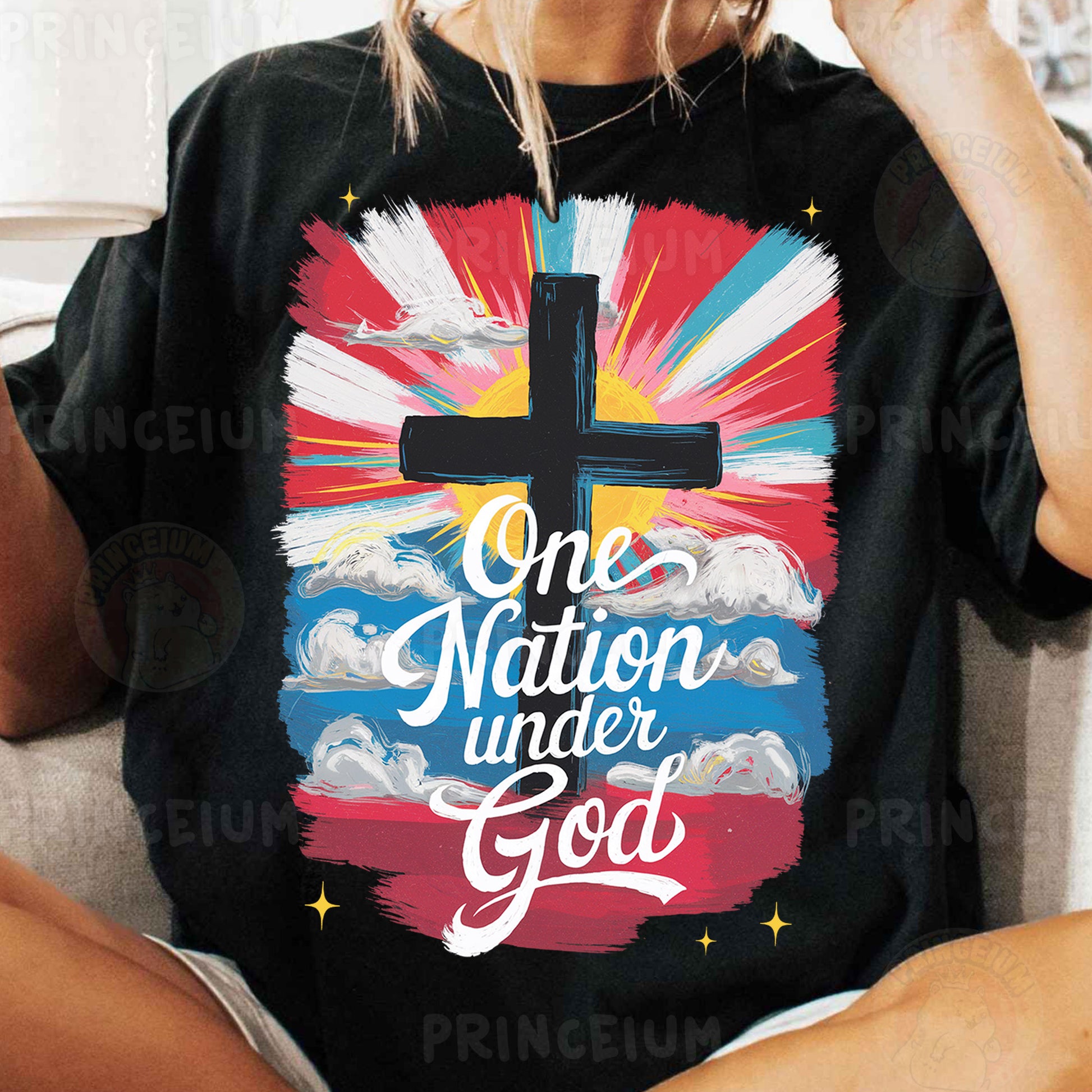 a woman sitting on a couch wearing a t - shirt with a cross on it