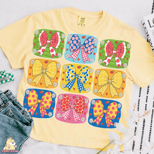 a t - shirt with bows on the front and a pair of jeans on the