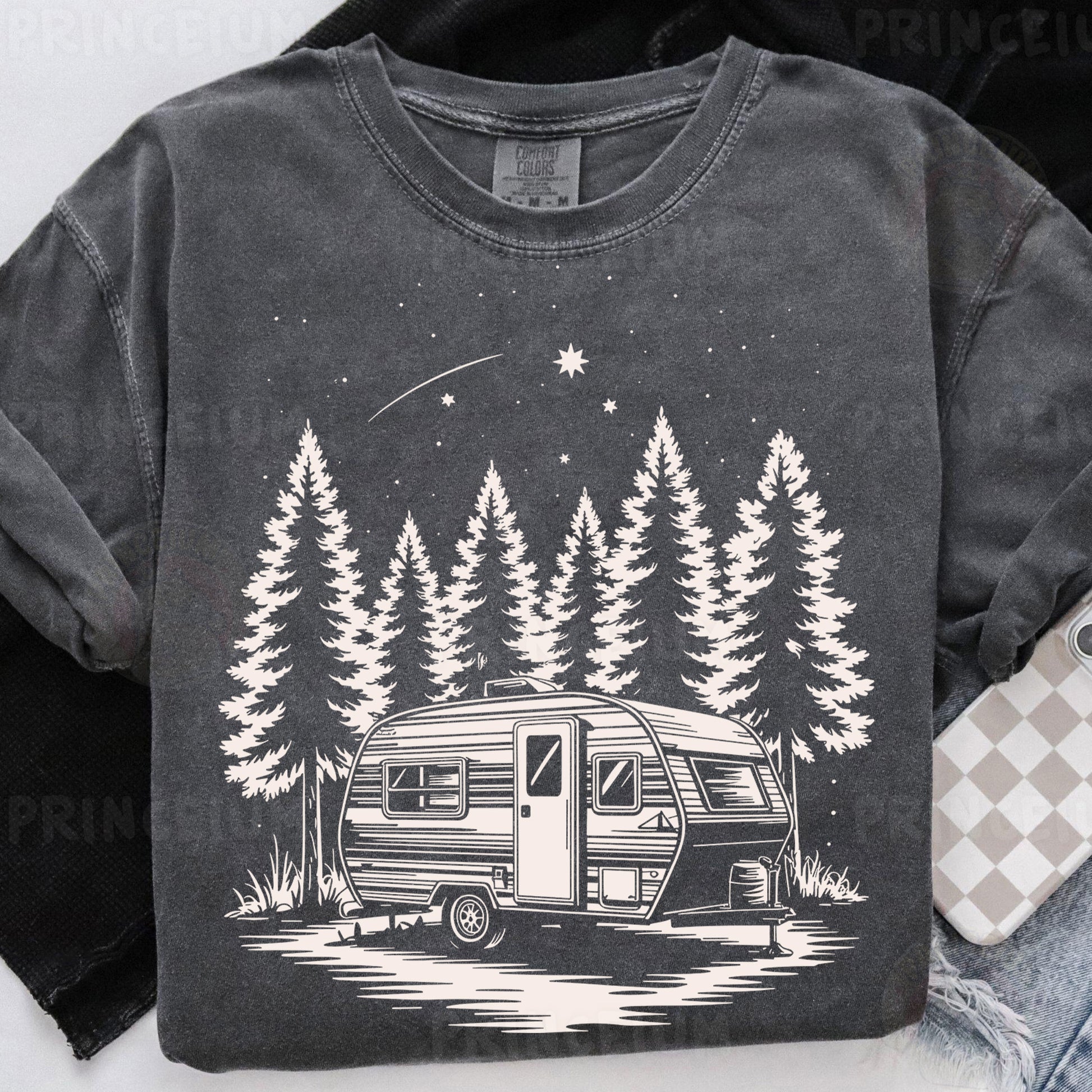 a t - shirt with a camper and trees on it