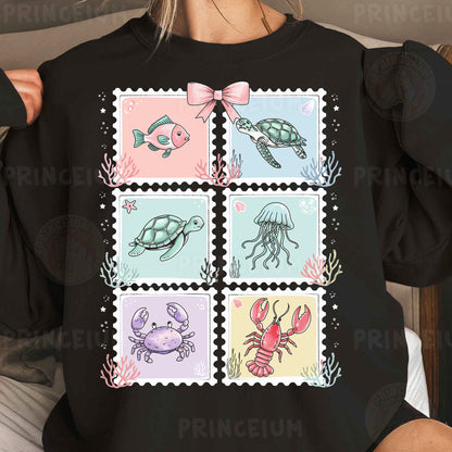 a woman wearing a t - shirt with stamps on it