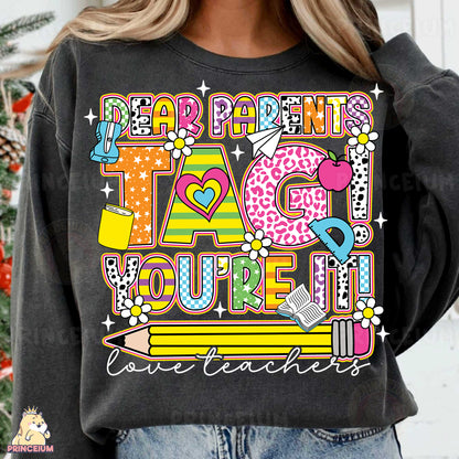 a woman wearing a black sweatshirt that says dear parents i love you're all