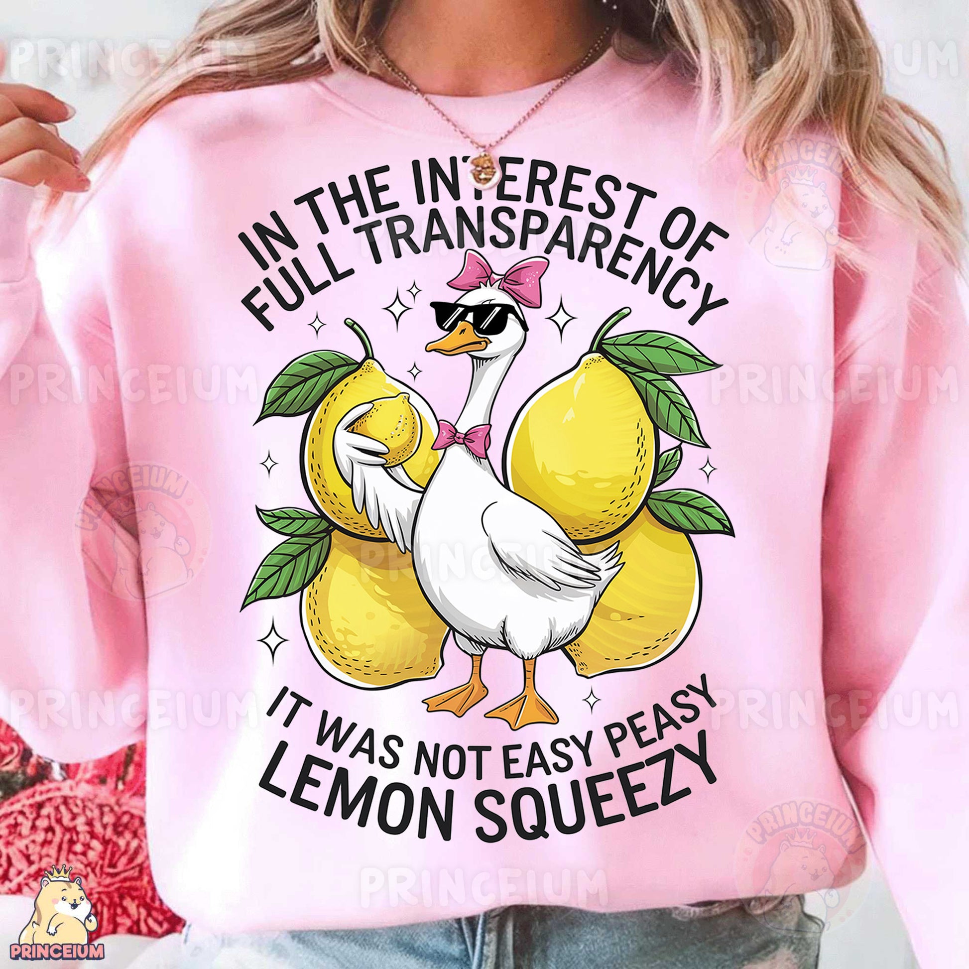 a woman wearing a pink sweatshirt with lemons on it