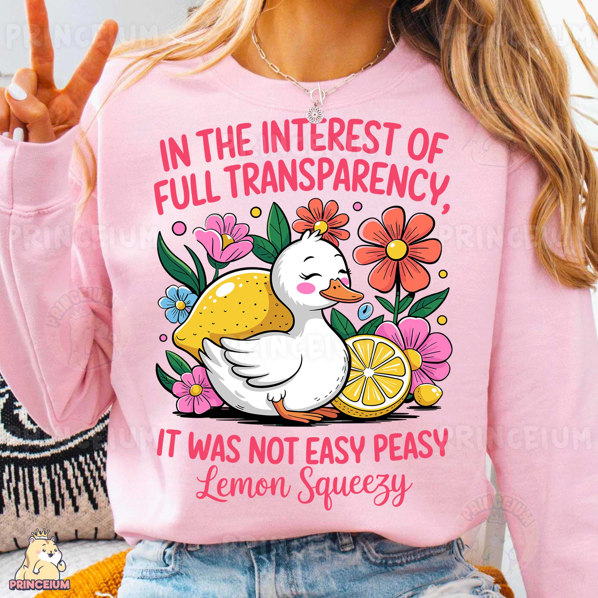 a woman wearing a pink shirt with a duck on it