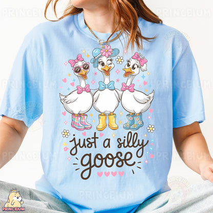 a woman wearing a t - shirt that says just a silly goose