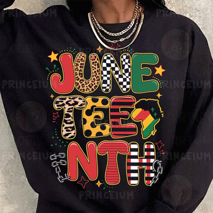 a woman wearing a black sweatshirt with a colorful graphic on it