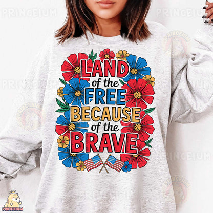 a woman wearing a sweatshirt that says land of the free because of the brave