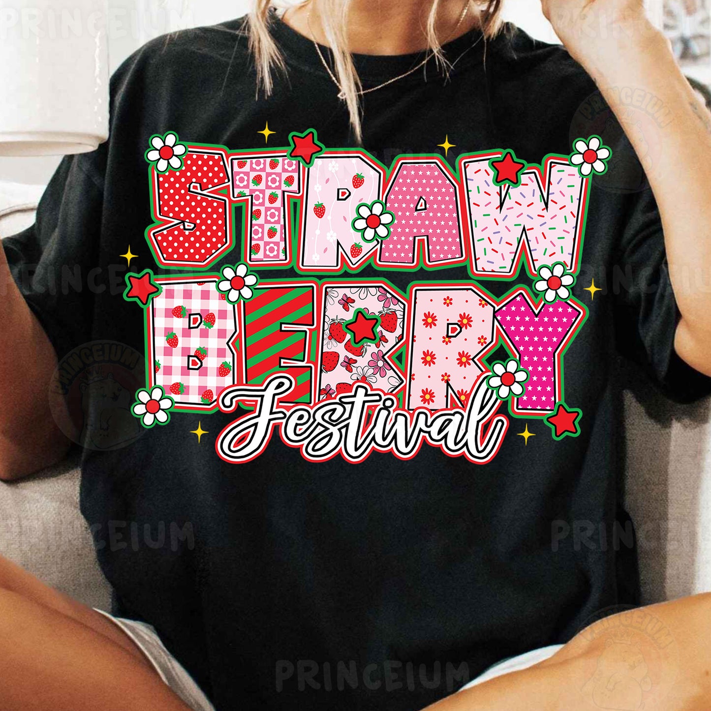 a woman sitting on a couch wearing a t - shirt with the words straw berry