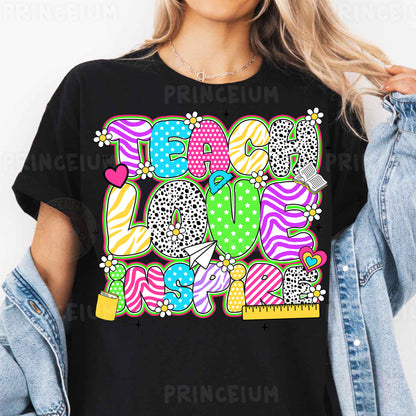 a woman wearing a black tshirt with colorful candy land on it