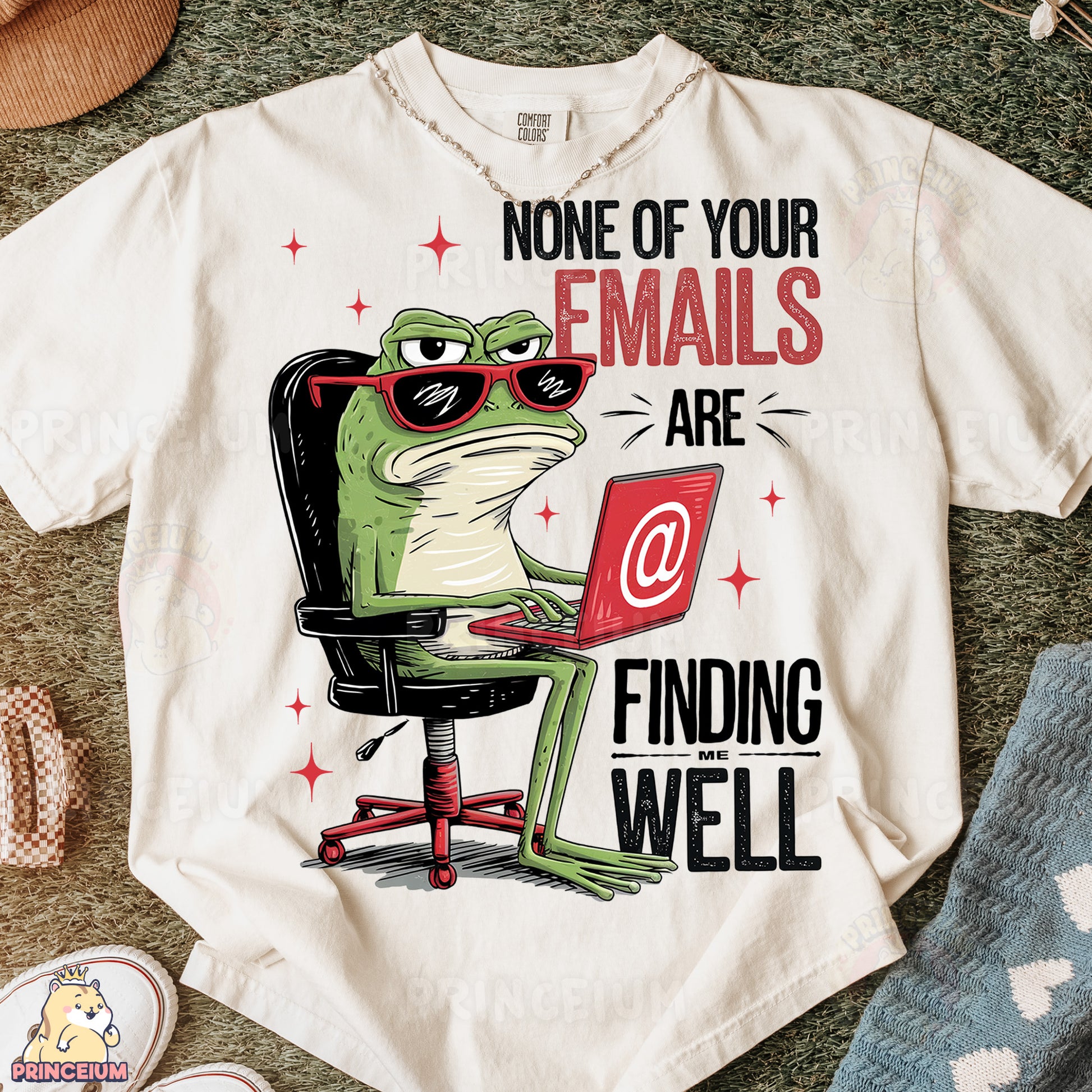 a t - shirt with a frog sitting at a computer
