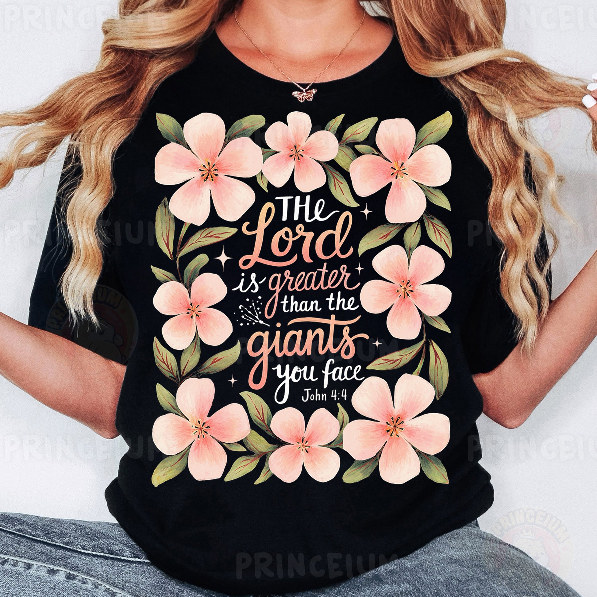 a woman wearing a black shirt with pink flowers on it