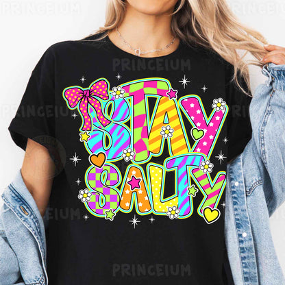 a woman wearing a t - shirt that says stay salty